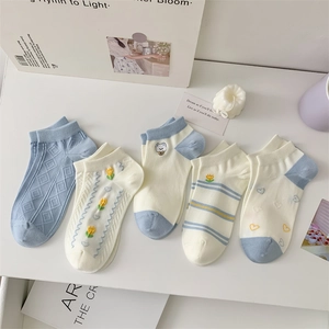 Set of five blue and white cotton socks featuring cute animal embroidery and floral patterns