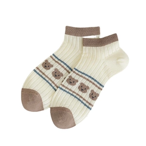 Bamboo fiber ankle socks in off-white with brown bear patterns and striped texture
