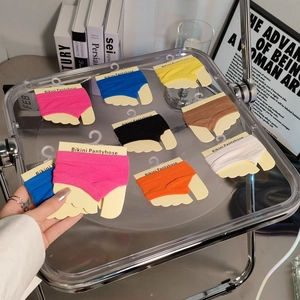 Multi-colored seamless forefoot toe socks displayed on card packaging in various soft shades