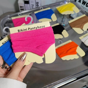 Macro shot of colorful miniature bikini pantyhose accessories in various bright knit colors