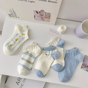Flat lay of five pairs of breathable cotton low-cut socks with blue animal embroidery
