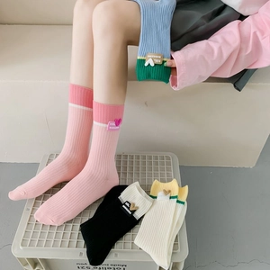 Colorful cotton crew socks set featuring ribbed texture and cute heart patches