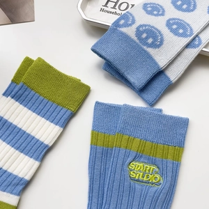 Three-pair set of blue knit cotton mid-calf socks with stripe and embroidery designs