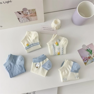 Detail of five pairs of breathable cotton ankle socks with cute animal and floral embroidery