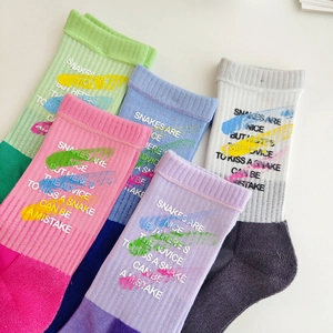 Five pairs of mid-calf cotton crew socks featuring colorful graffiti and ribbed knit design