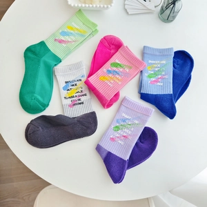 Set of five colorful graffiti cotton mid-calf socks for women in soft pastel tones