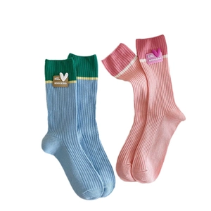Colorful ribbed mid-calf cotton socks with heart patches in blue, green, and pink tones