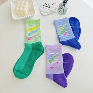 Three-pack cotton mid-tube socks with graffiti brushstroke prints and ribbed cuffs