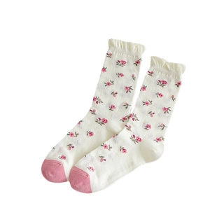 Breathable mid-calf socks with floral print, ruffle edges and pink toe accents