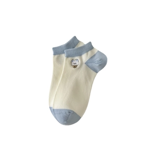 Blue and beige cotton ankle socks with cute bear embroidery on minimalist background