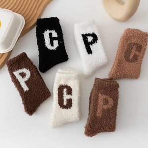 Thick warm coral fleece crew socks with letter patterns in assorted neutral colors