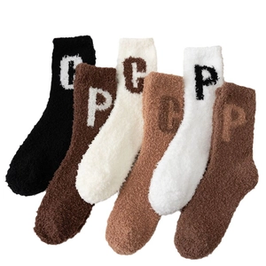 Thick coral fleece crew socks in six assorted neutral colors with letter embroidery