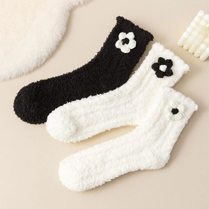 Thick coral fleece winter socks with floral knit accents in black and white colors