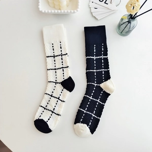 Japanese style Lolita plaid knit mid-calf socks in black and white with ruffled edges
