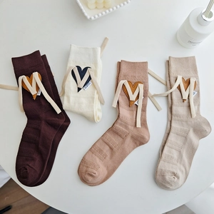 Mid-calf cotton knit socks set with leather heart patches and white ribbon bows
