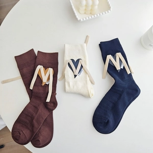 Three pairs of Korean style cotton crew socks with heart patches and M-shaped ribbon details