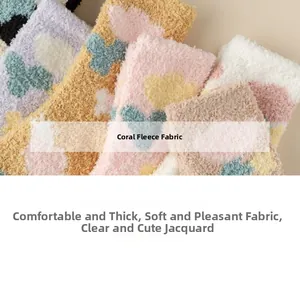 Detail of soft coral fleece socks featuring cute flower patterns and thick texture