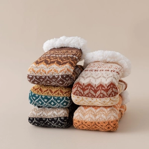 Close-up of winter thermal knit socks with thick fleece lining and Nordic patterns