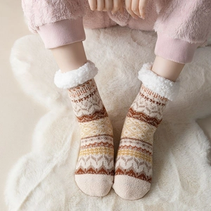 Detail of thick fleece lining and ethnic jacquard pattern on thermal winter floor socks