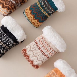 Detail of fleece-lined socks showing colorful knit patterns and soft white wool interior