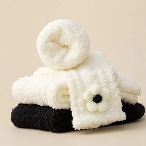 Thick coral fleece socks in black and white with floral knitting on cozy plush fabric