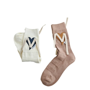 Chic knit crew socks with heart leather patches and ribbon ties in beige and brown