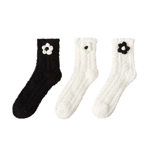 Thick coral fleece socks for women with knit flower details in black and white colors