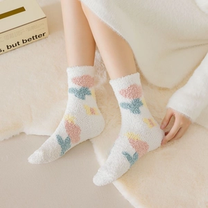 Thick coral fleece socks for women featuring colorful floral patterns on white plush fabric