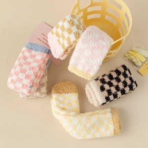 Detailed view of five colorful checkerboard coral fleece thermal socks in a cozy layout