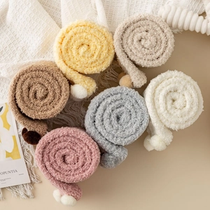 Thick coral fleece over-knee socks with pom-poms in six colors for winter warmth
