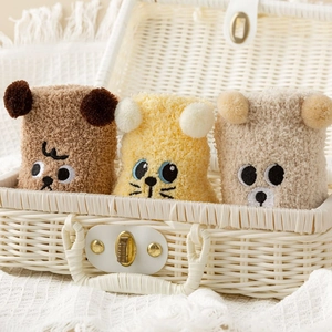 Three pairs of coral fleece over-knee socks featuring cute animal face embroidery
