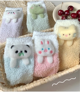 Five pairs of thick coral fleece socks with cute 3D animal heads in a woven basket