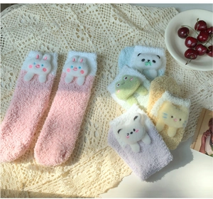 Detailed close-up of cute coral fleece thermal socks in assorted macaron colors