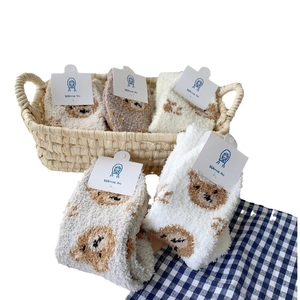 Thick coral fleece winter socks with cute bear patterns in various warm neutral colors