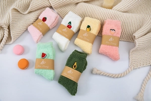 Detailed set of six coral fleece thermal socks featuring vibrant fruit embroidery details