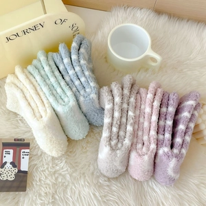 Thick coral fleece striped warm home socks in six pastel colors on white plush carpet