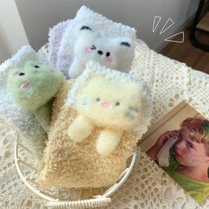 Cozy thick coral fleece socks with cute 3D animal embroidery in a decorative basket
