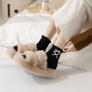 Chic black coral fleece mid-calf socks with white bows and plush home slippers