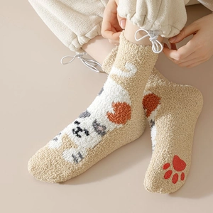 Detailed texture of thick fleece cat socks with cute paw patterns and bow tie details