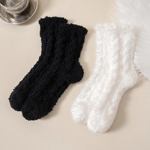 Thick fuzzy coral fleece socks for women in black and white colors for winter warmth