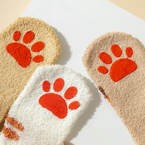 Detail of coral fleece cat claw socks with non-slip 3D paw pads for winter comfort