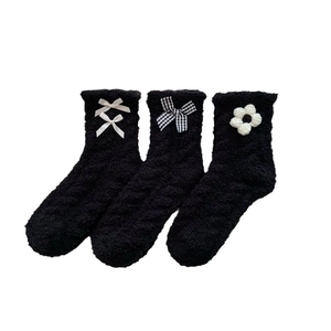 Three-pack black coral fleece mid-calf socks with white bow and flower accents