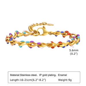 Macro detail of 18K gold plated stainless steel bracelet with colorful enamel dots