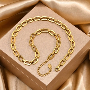 Macro shot of 18K gold plated paperclip chain jewelry with lobster clasp and K18 tag