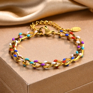 Close-up of 18K gold plated chain with colorful enamel spots and lobster clasp detail
