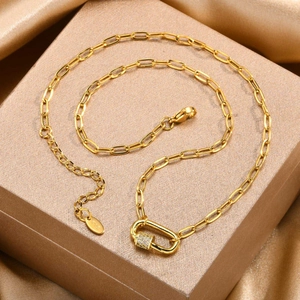 Close-up of 18K gold plated paperclip chain with a sparkling pavé zircon lock pendant