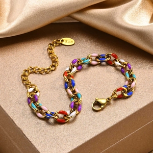 Macro view of 18K gold stainless steel chain bracelet with colorful enamel links