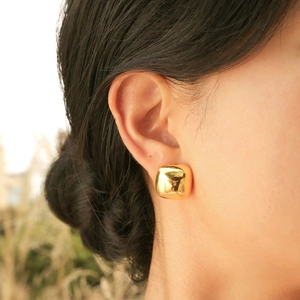 Elegant 18K gold plated square geometric stud earrings on a female model