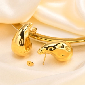 Minimalist 18K gold irregular hollow drop earrings with a polished liquid metal texture