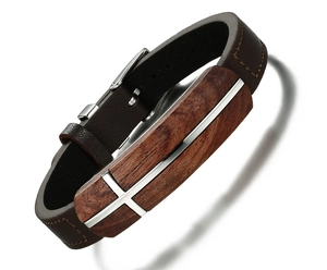 Detail of brown leather strap with rosewood inlay and silver metal cross on men's bracelet